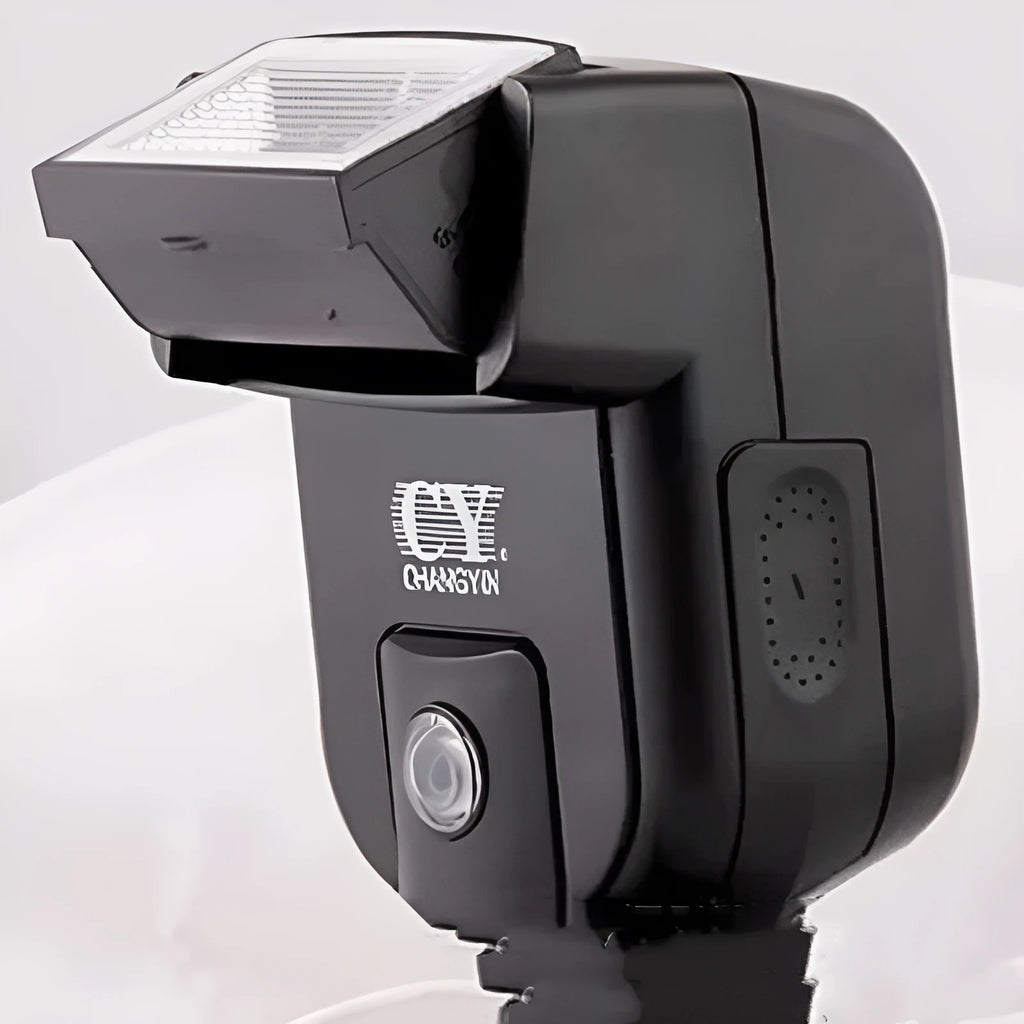 Silver hot shoe flash unit with head rotated upward, shown mounted on a DSLR camera.