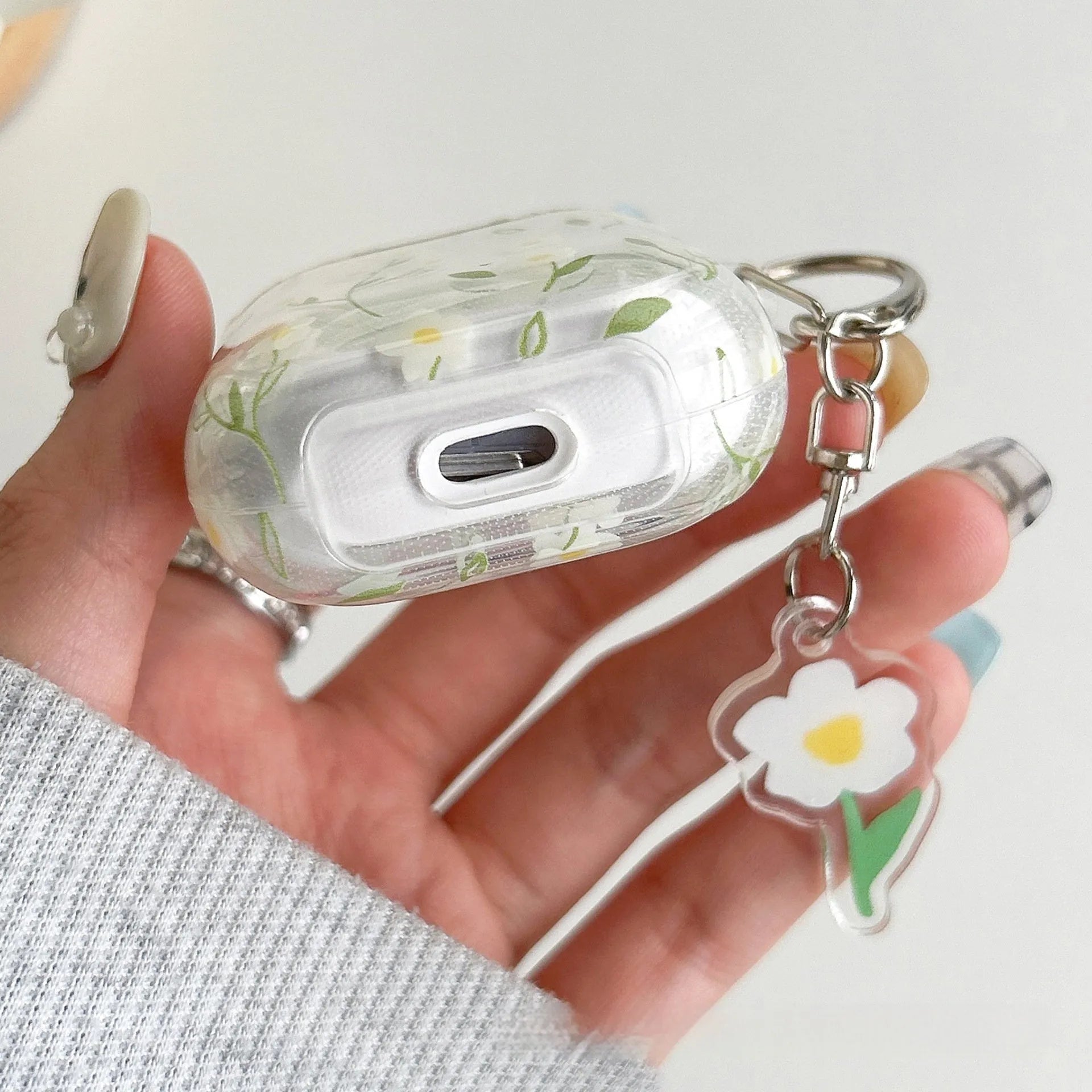 White floral design on clear TPU protective cover for Apple AirPods charging case