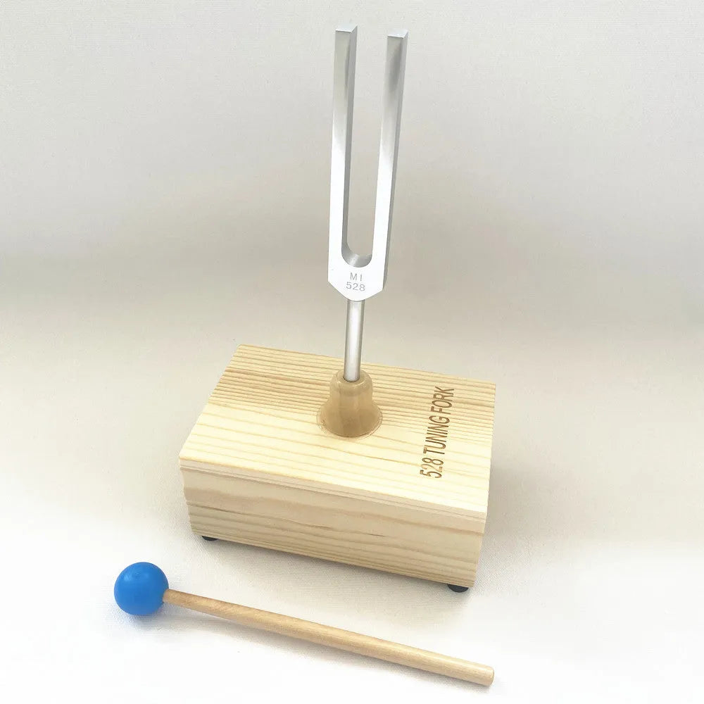 Aluminium alloy 432Hz tuning fork and speaker set on kraft paper box