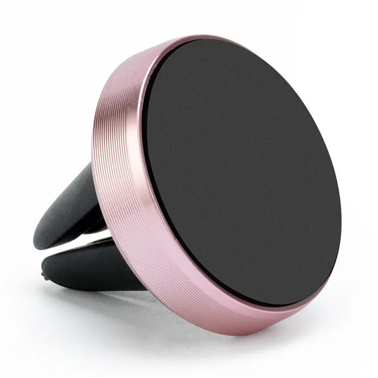 Magnetic car phone holder attached to vehicle air vent with smartphone mounted