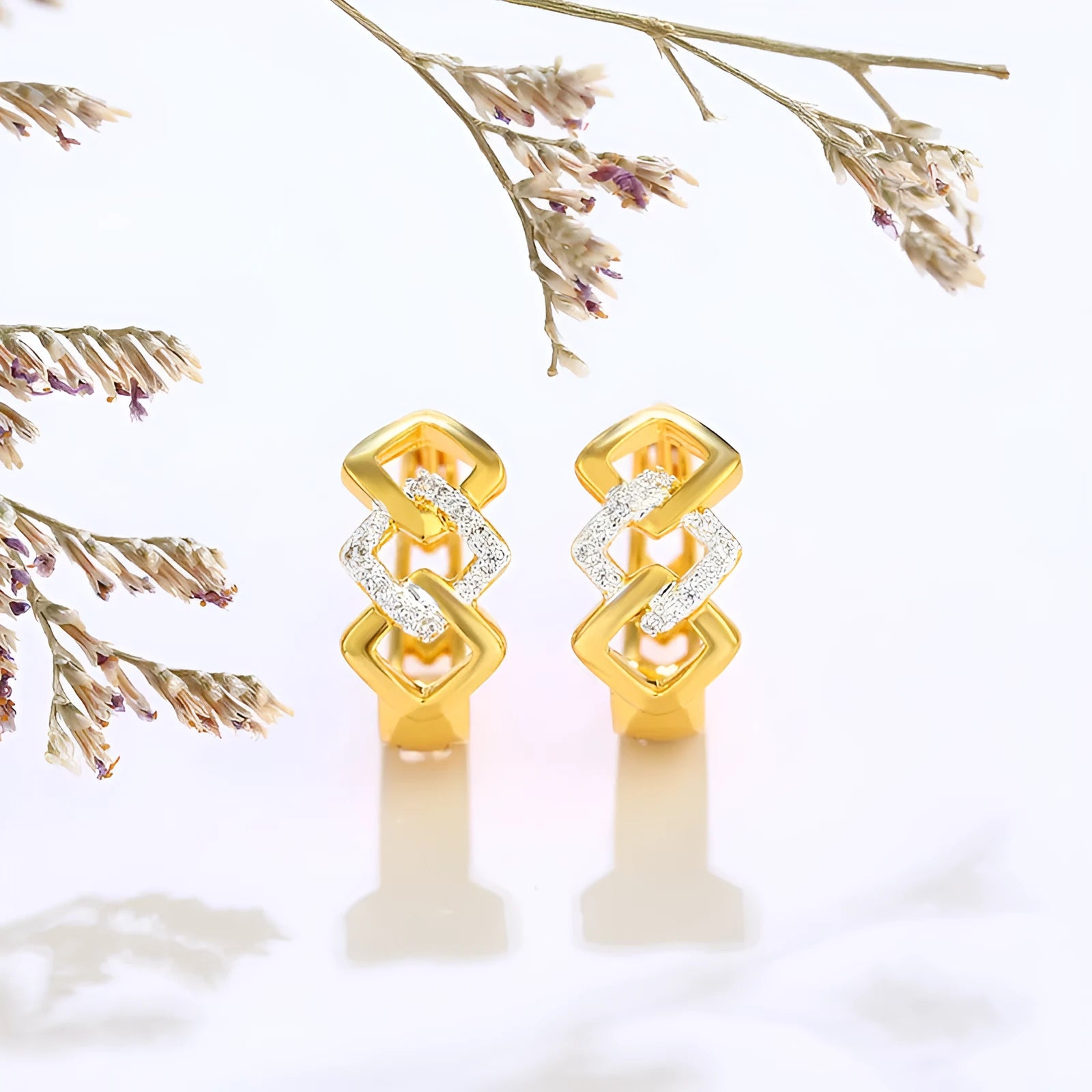 Gold geometric hollow-out earrings with colour separation detail on ear clip