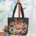 Canvas embroidery handbag with gold wire detail shown in an artistic colour design.