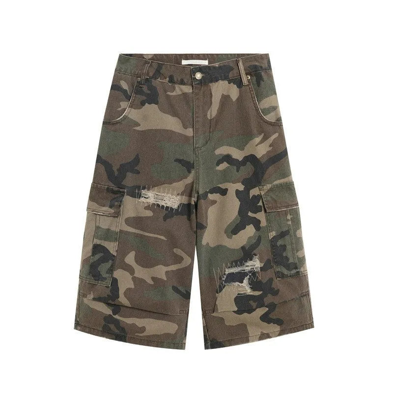 Men's loose fit camouflage patch ripped cropped jeans in a straight leg style.