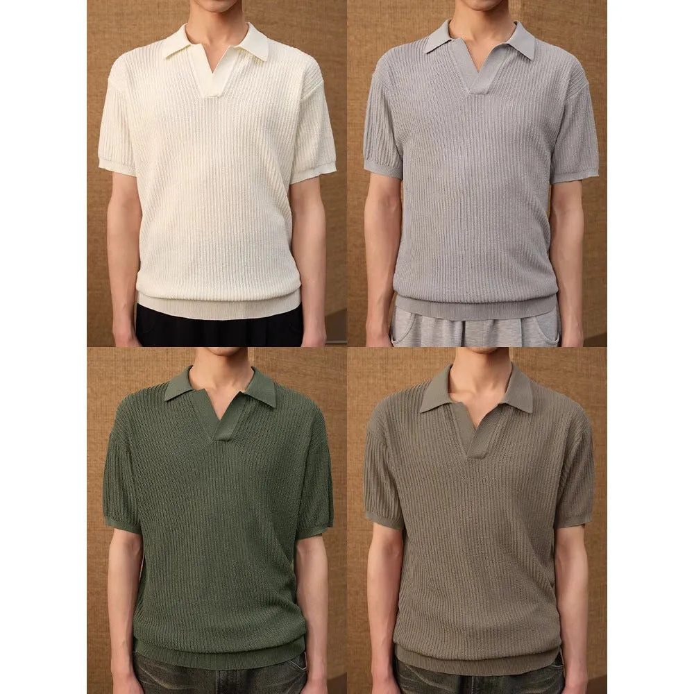 A creamy-white loose-fit polo shirt with a striped collar and short sleeves on a hanger.