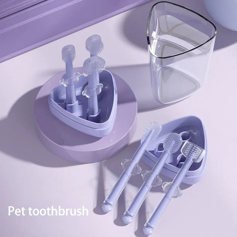 Soft silicone pet toothbrush for dogs and cats in blue, green, and purple colours for cleaning teeth and reducing bad breath.