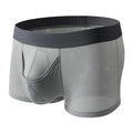 Men's solid colour ice silk boxer shorts showing low waist and breathable mesh fabric.