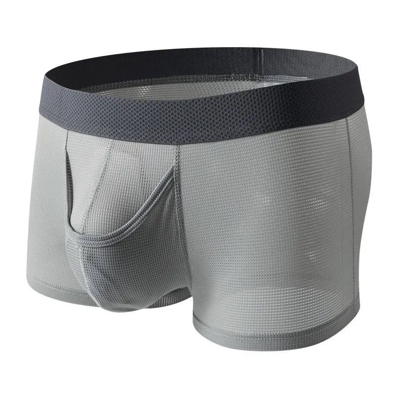 Men's solid colour ice silk boxer shorts showing low waist and breathable mesh fabric.