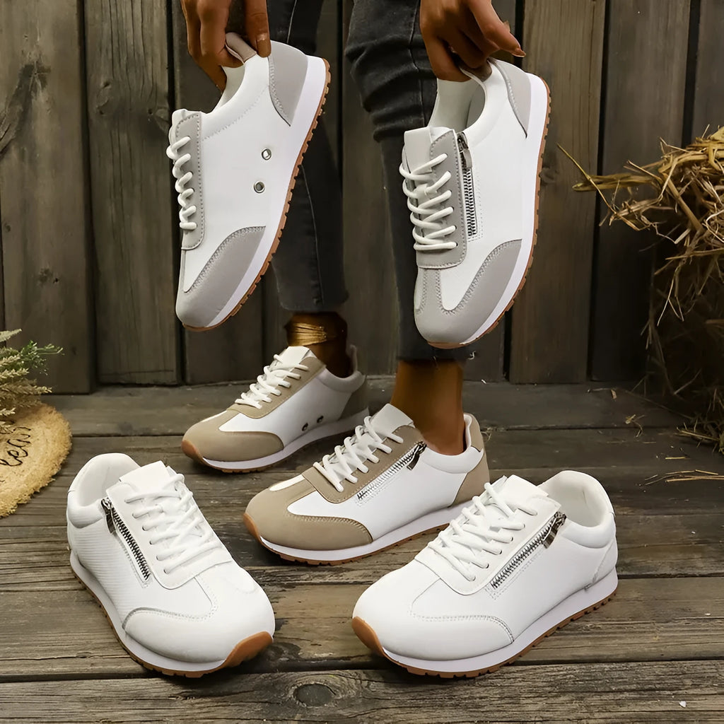 Women's flat shoe in artificial PU, rubber sole, shown in grey, white, or Champagne colour.