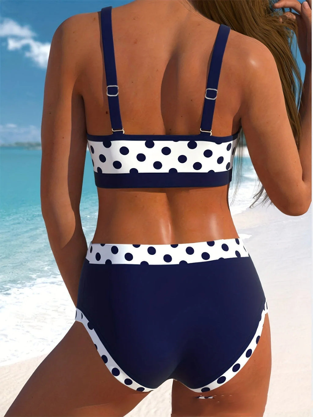 Men's multicolour small wave dot pattern swim briefs on a plain background.