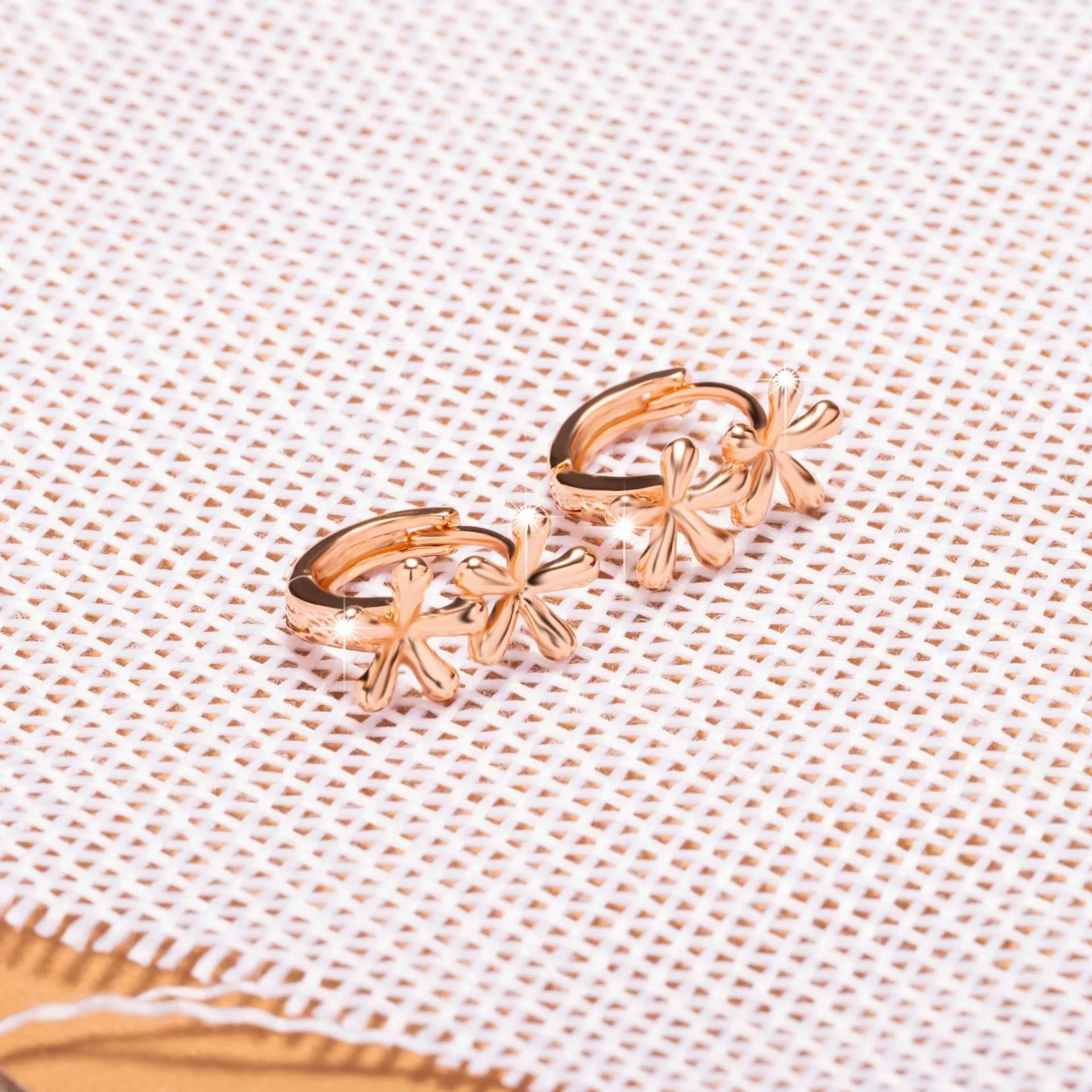 Rose gold electroplated circular earrings with waterdrop flower design in European and American style