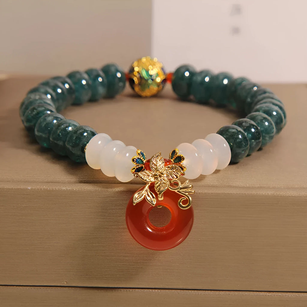 Women's crystal bracelet with blue water jade and red agate beads featuring safety buckle closure