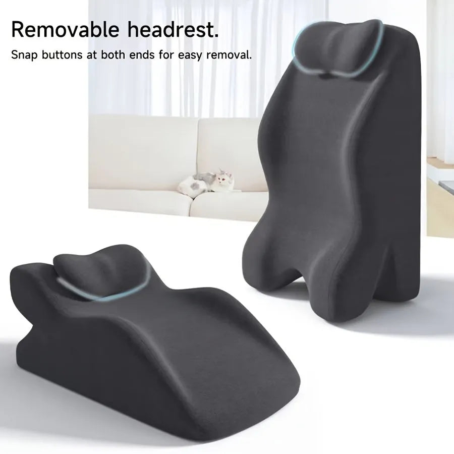 A stomach sleeper's pillow in a choice of blue, dark grey, green, or light grey, shown supporting a person lying on their front.