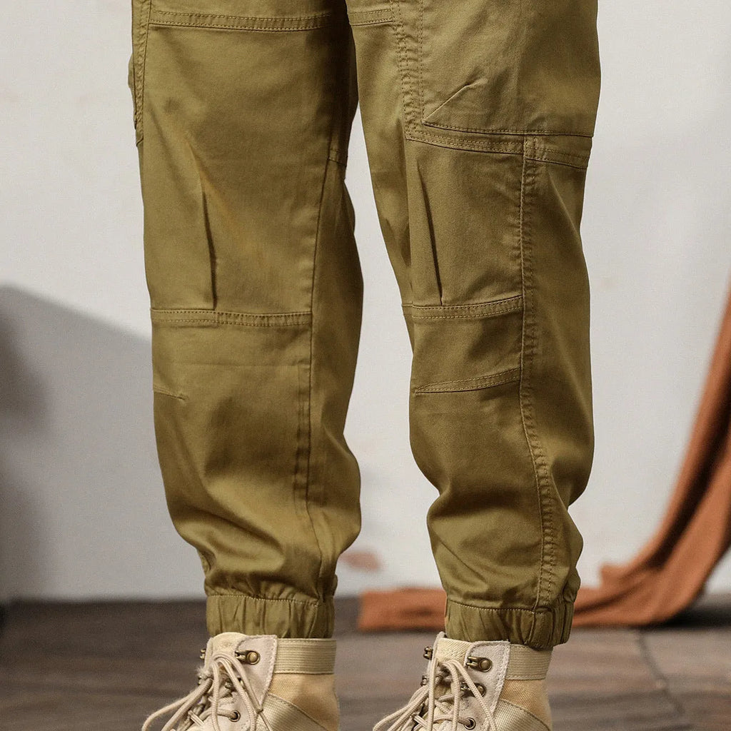 Men's khaki coloured loose fit cotton harem pants with a tapered ankle band.