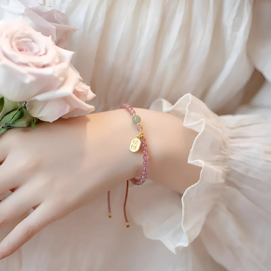 Red rope bracelet with strawberry quartz crystal and hand-woven construction for women