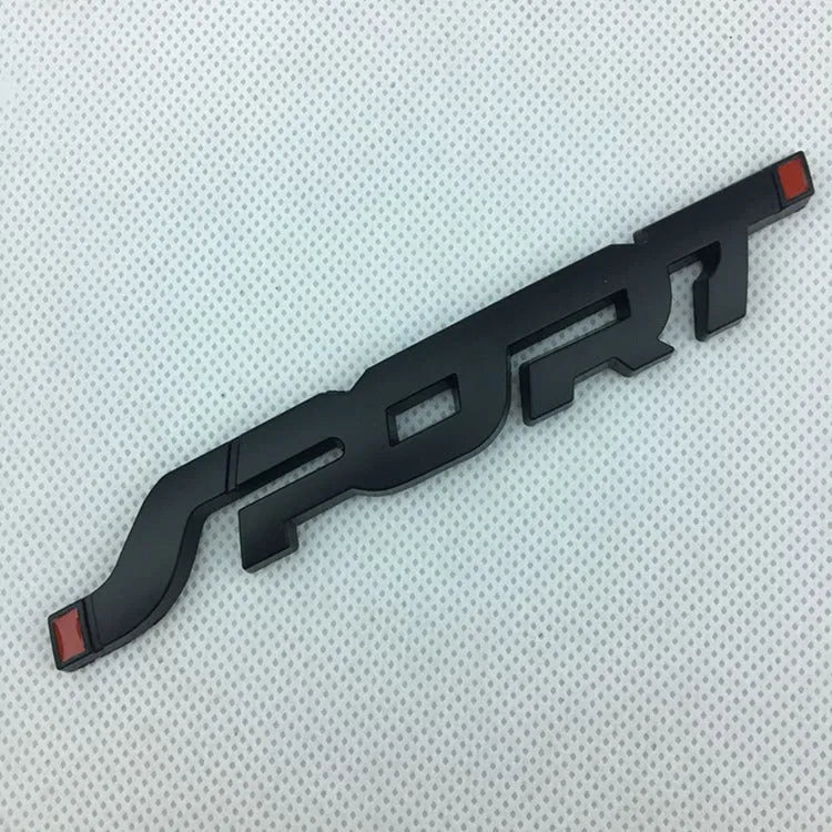 Metal car sticker with 3D effect in silver on a sports car exterior showing simple style