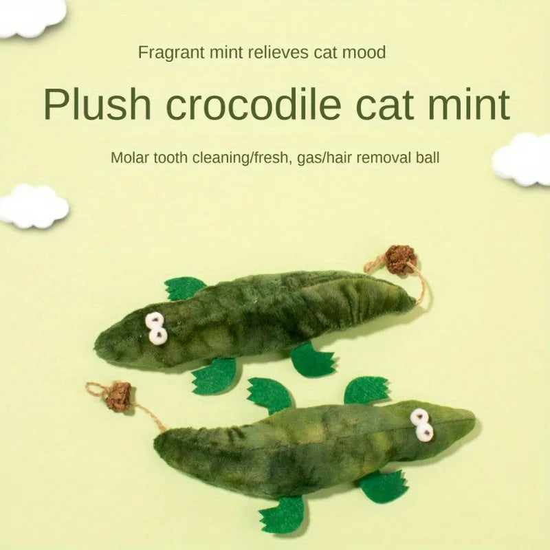 Green alligator-shaped cat toy with catnip and peppermint scent for oral cleansing