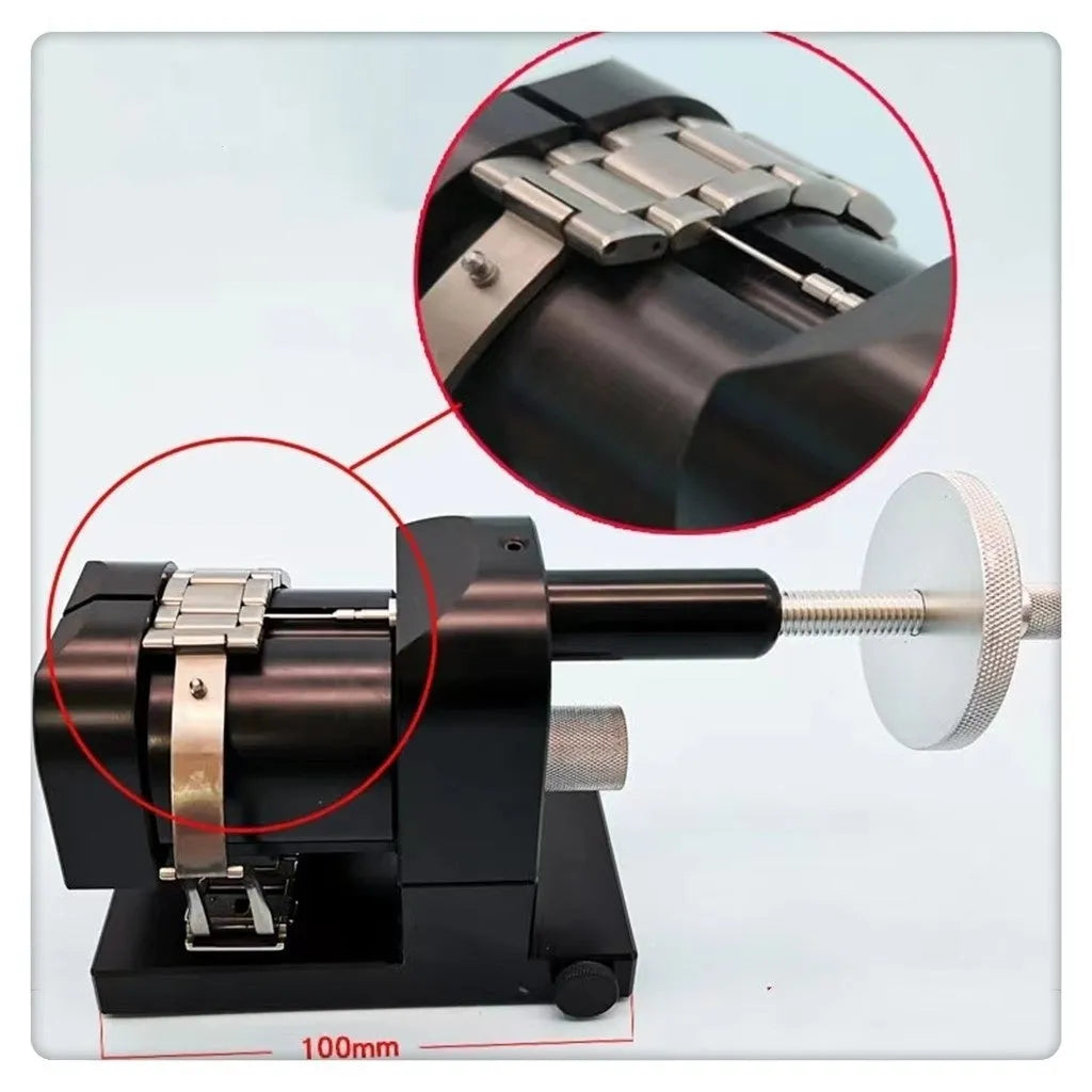 Alloy steel watch strap stripping machine tool for watch repair on a workbench.