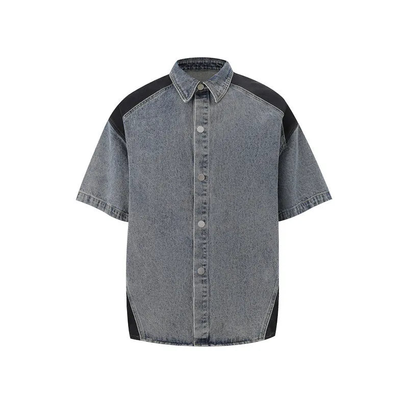 Retro washed blue denim short-sleeve jacket and trouser suit set laid flat.