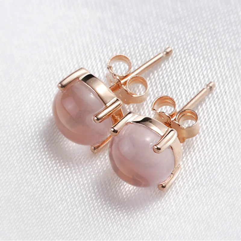 Women's rose gold drop shape stud earrings with crystal inlay detail
