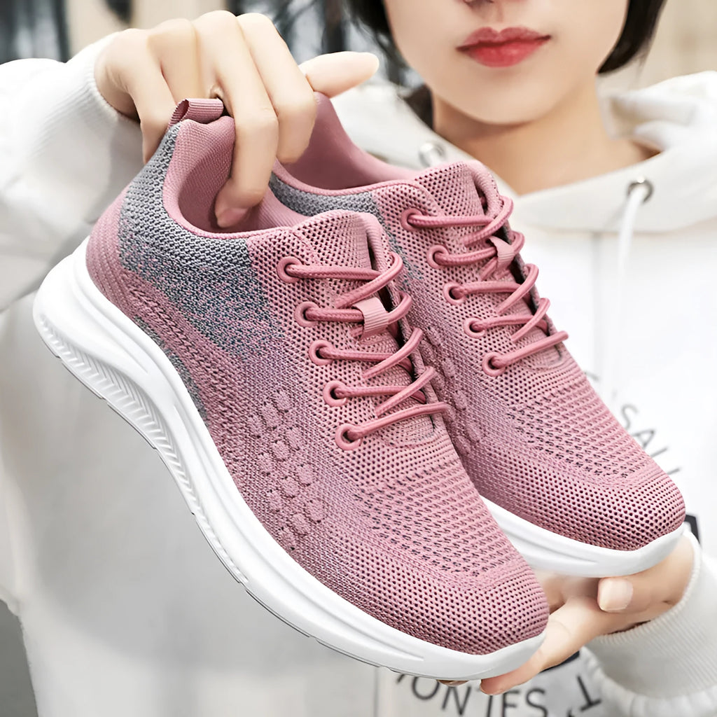 Women's low-top black mesh sneakers with round toe and white PVC sole, featuring front lace-up design.