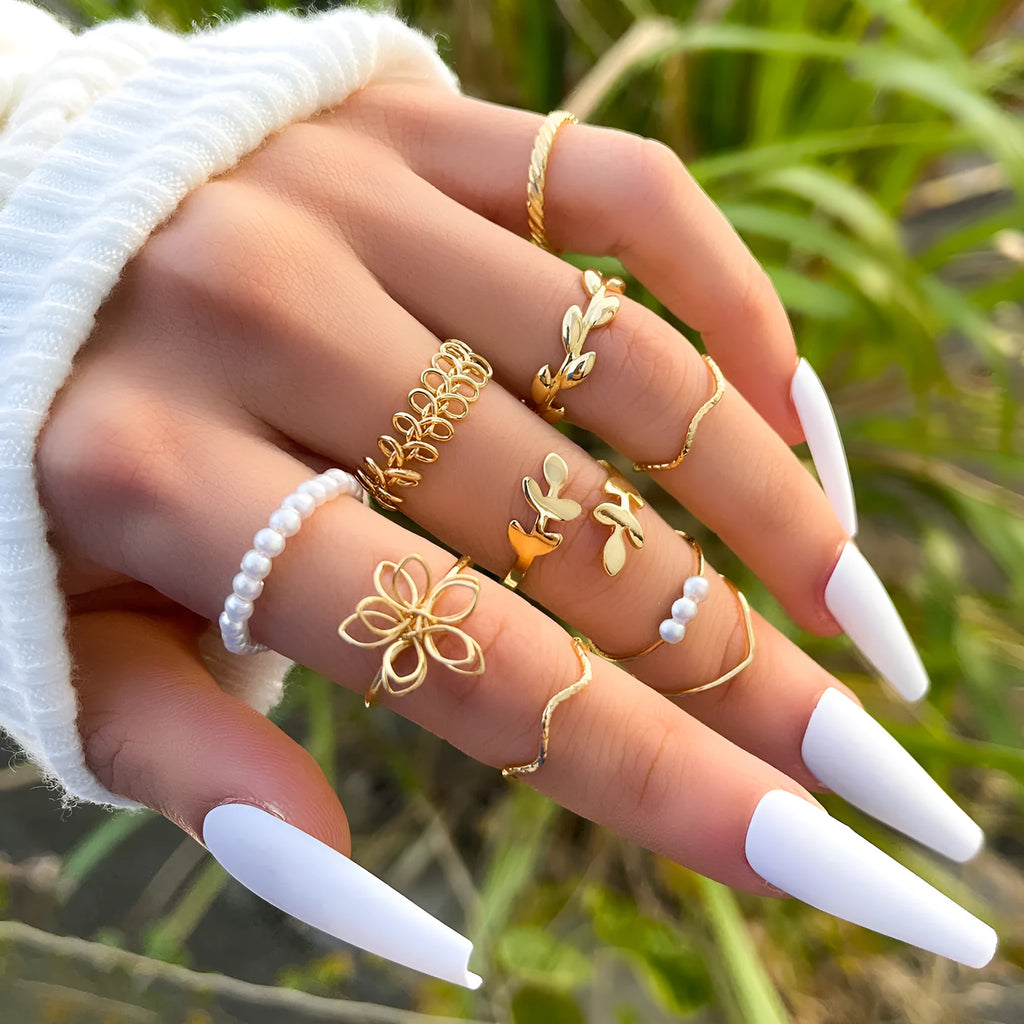 Gold openwork floral pattern alloy ring with electroplated glossy finish
