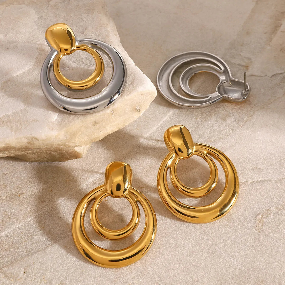 Golden round double layer hollow stud earrings with geometric design on titanium steel