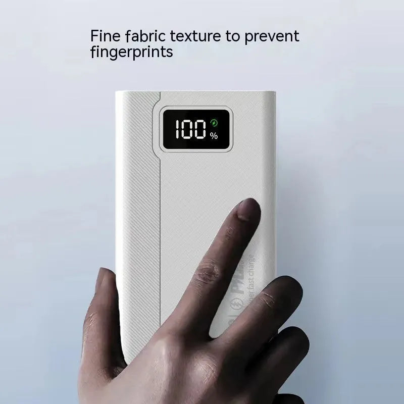 Large capacity power bank in black or white plastic casing with dimensions 150mm x 76mm