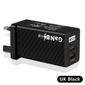 Compact white 65W GaN laptop charger with USB-C port next to EU plug.
