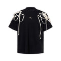 Black T-shirt with rivet ribbon padded shoulders, loose fit, round neck collar