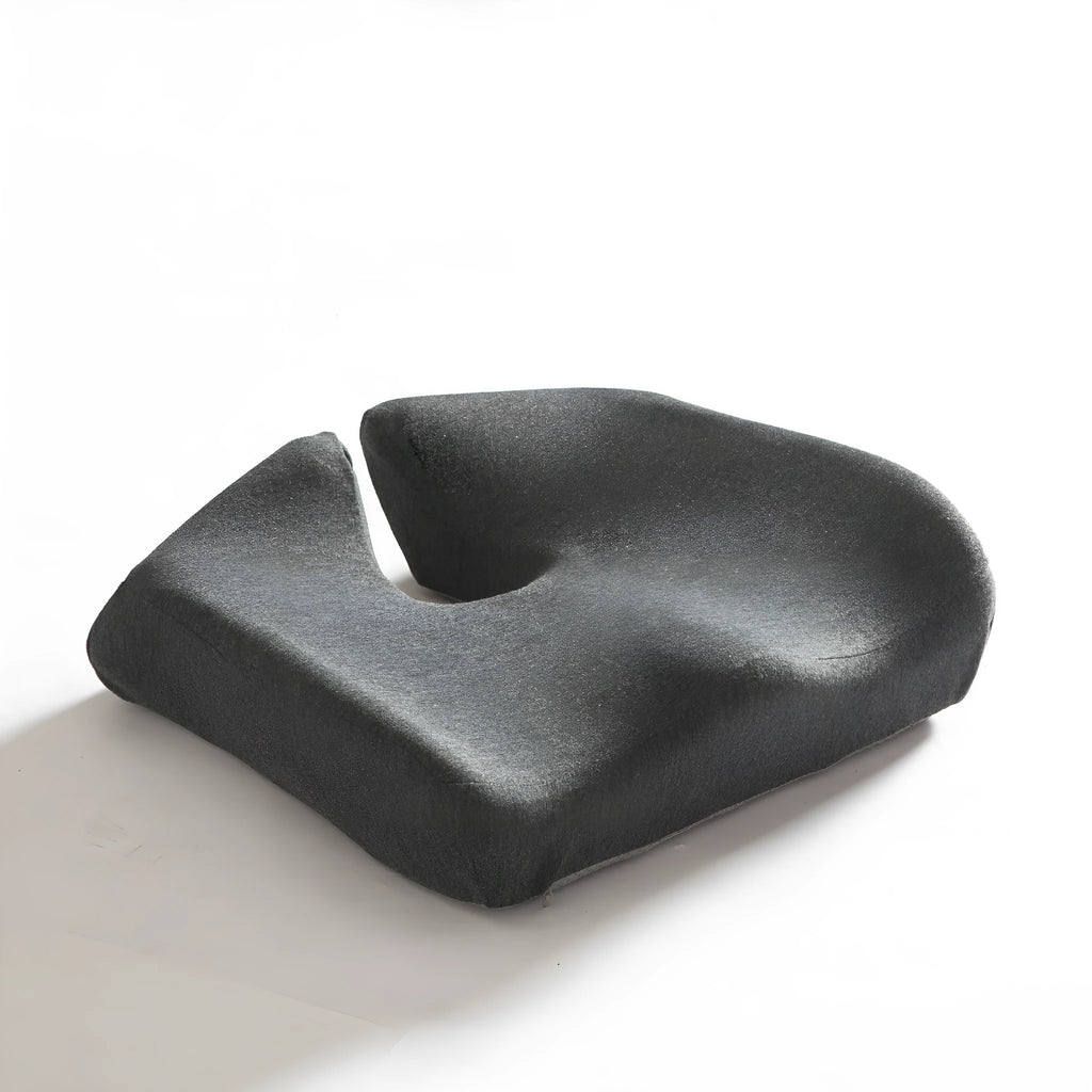 Memory foam office chair cushion with waist support in grey colour on wooden chair