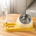 Elevated cat food bowl with automatic water dispenser bottle in choice of brown, green or yellow colours