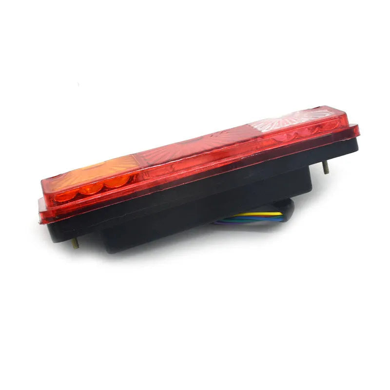 Black semi-closed taillight for electric tricycle, 200mm wide by 70mm high.