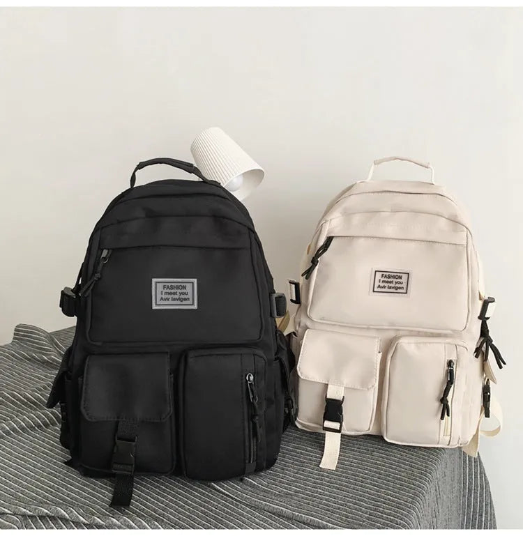 Black student backpack with three-dimensional pockets showing computer compartment