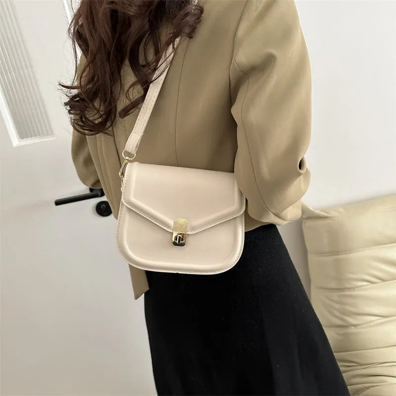 Soft, textured PU clamshell messenger bag in a horizontal rectangle shape.