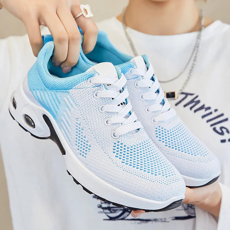 Women's striped Flyknit casual running shoes in pink with a round toe and flat PVC sole.