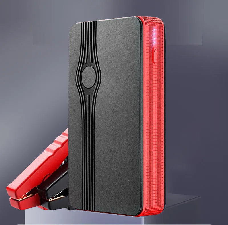 Red K4-E automobile emergency jump starter and power bank unit with data cable.