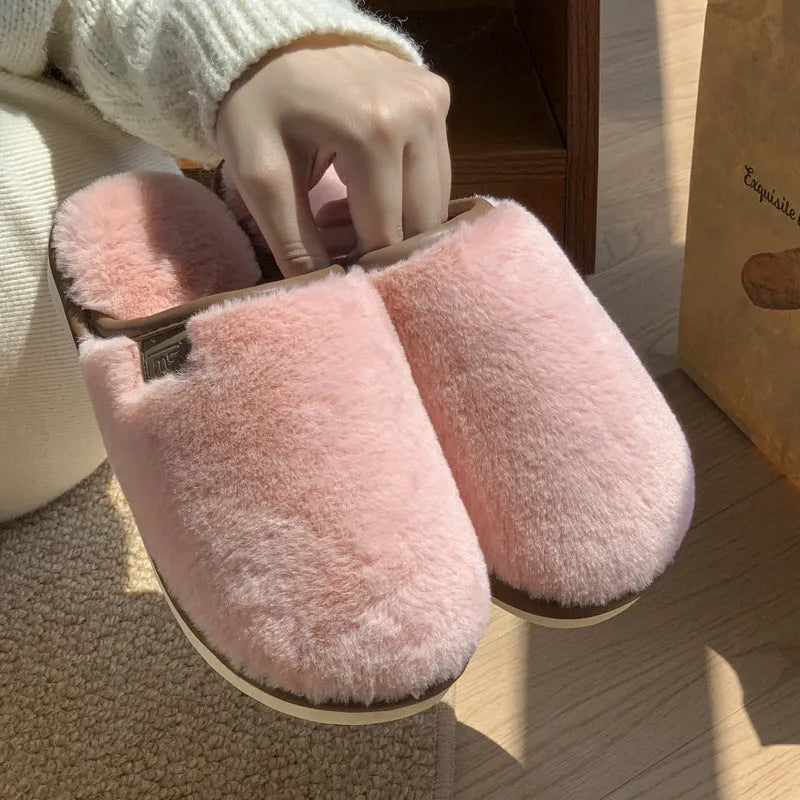 PVC plush winter slippers in a solid colour with a non-slip sole for indoor wear.