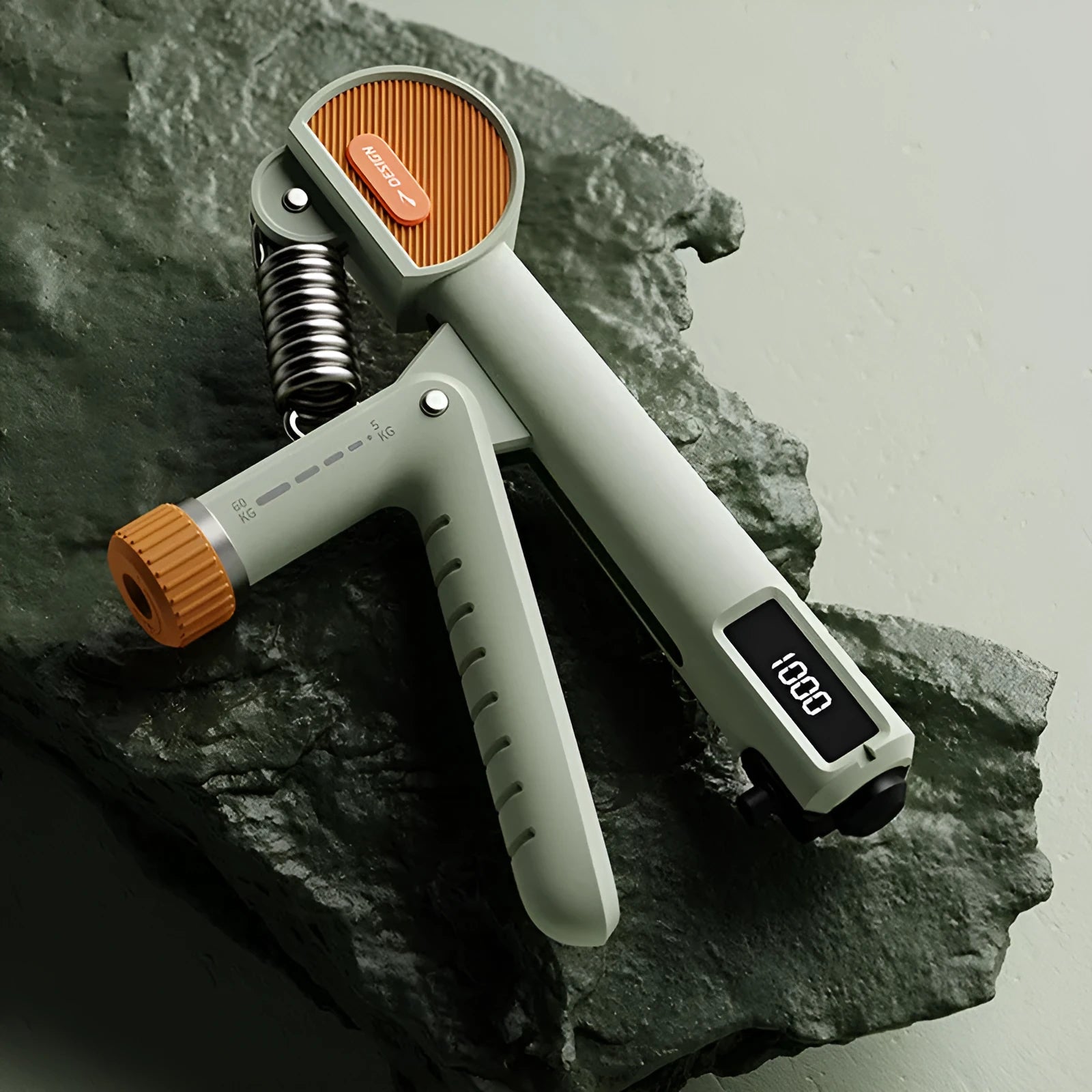 Adjustable spring hand gripper exercise tool in ivory white, black, or green colour.
