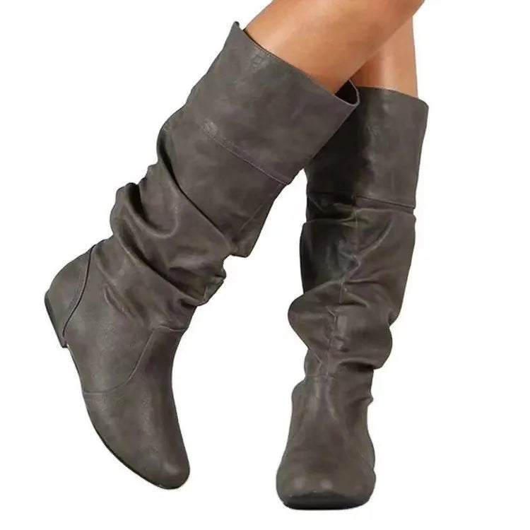 Women's black flat-heel slip-on long boots with a round toe and high cylinder shaft.