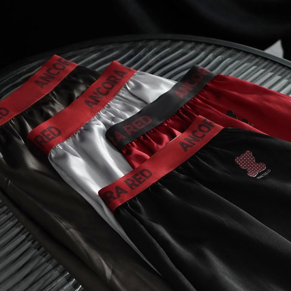 Men's solid colour boxer briefs in black, shown with mid waist design