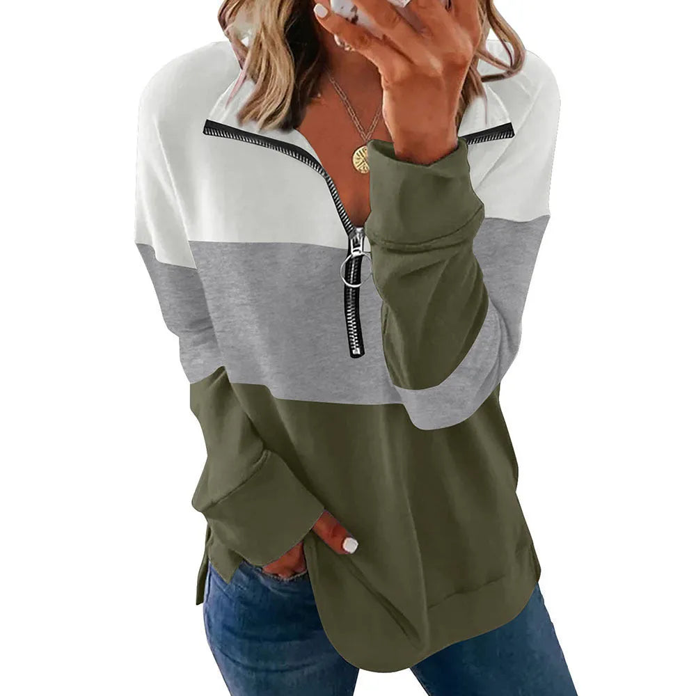 Women's loose-fit long-sleeved leopard print pullover sweater on a hanger.