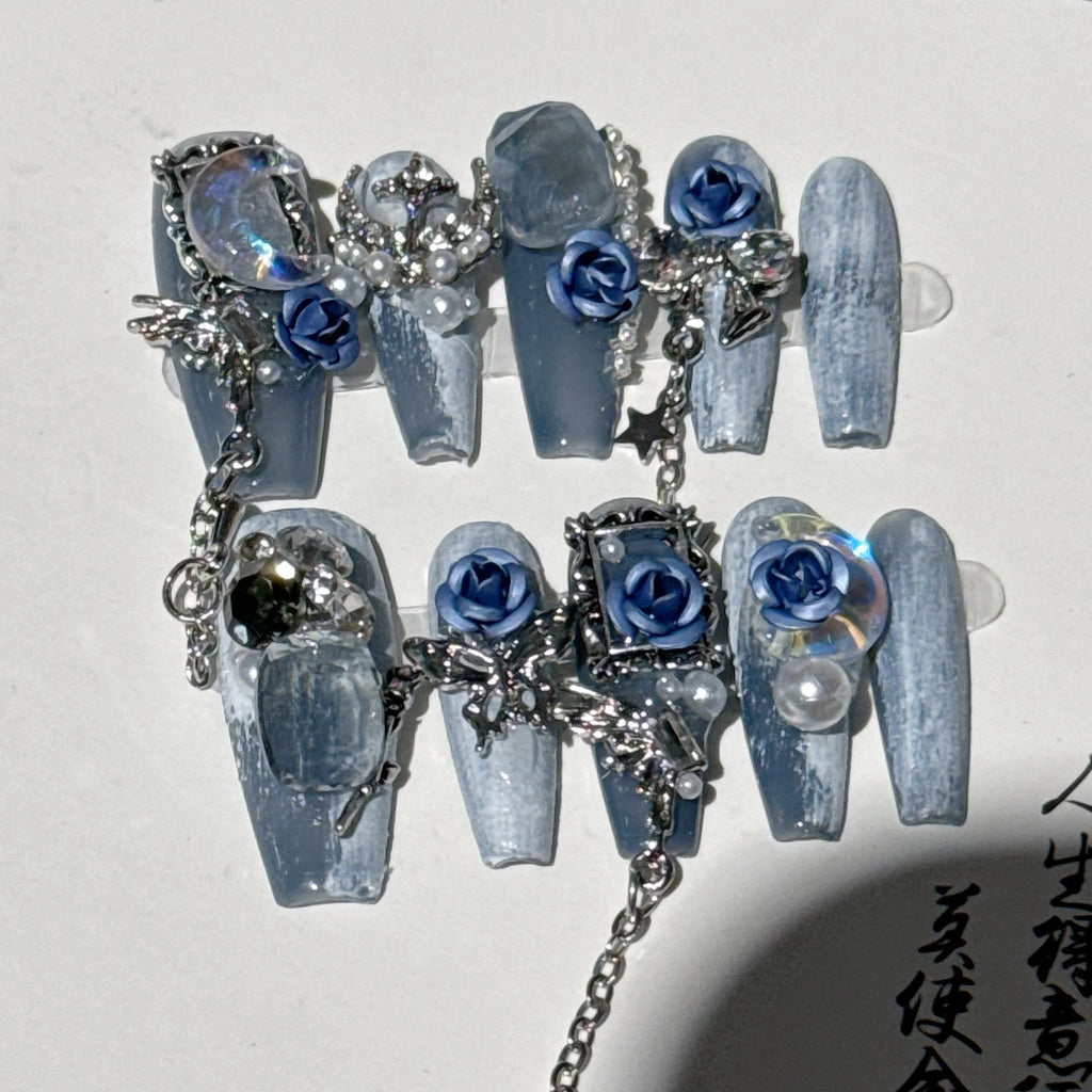 Blue evening manicure set with rose pattern on plastic nail armour suit