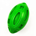 Natural rubber squeaky dog chew ball with textured surface grooves in blue, green, or orange colours