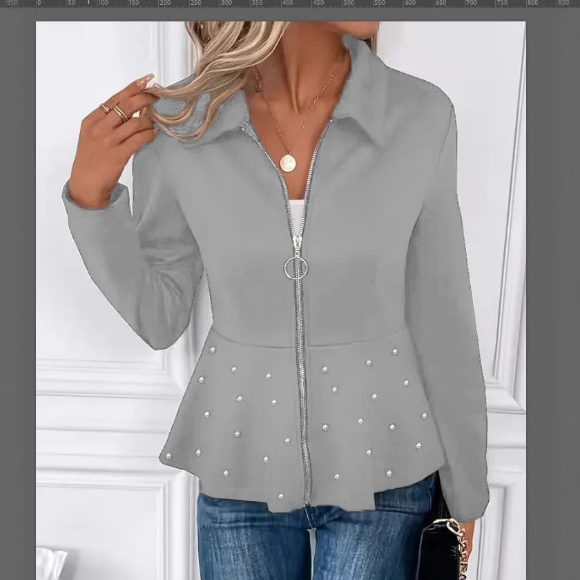 Women's black loose fit coat with beaded heavy-duty zipper and ruffled hem detail.