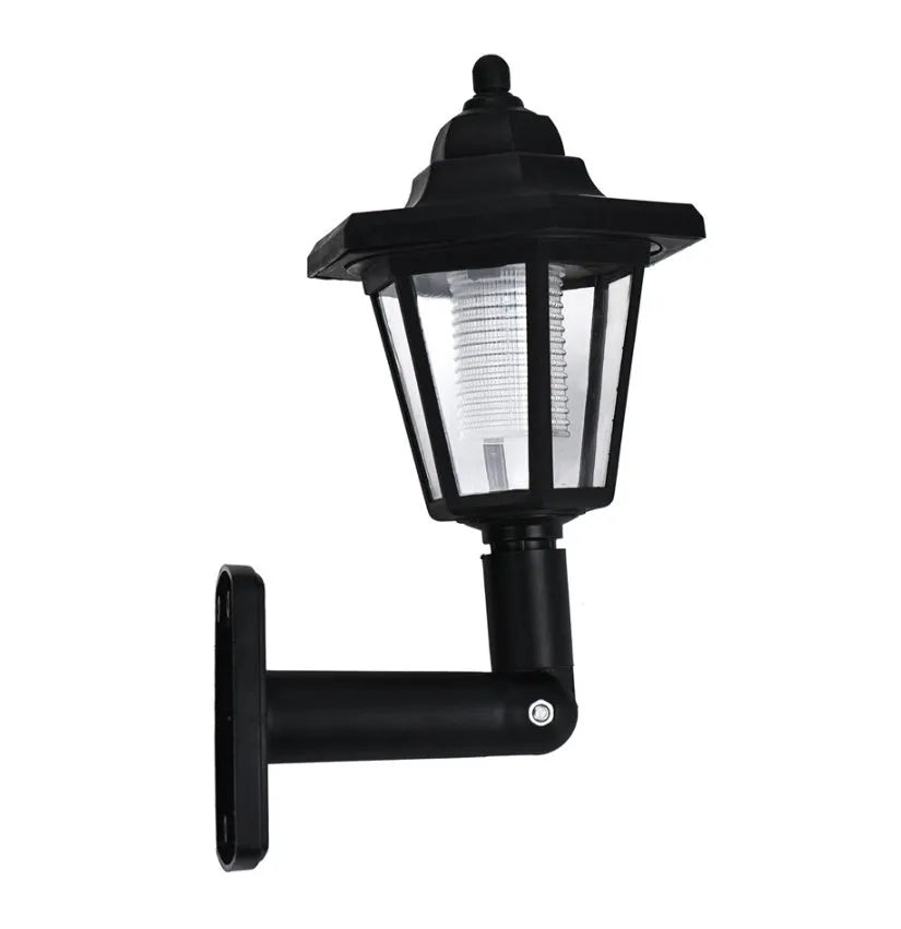 Black hexagonal solar wall lamp with integrated solar panel for outdoor garden or patio lighting