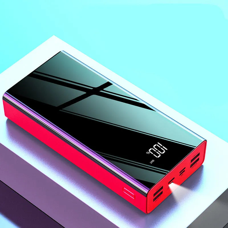 Large black and red 40000mAh power bank with LCD digital display showing battery percentage.