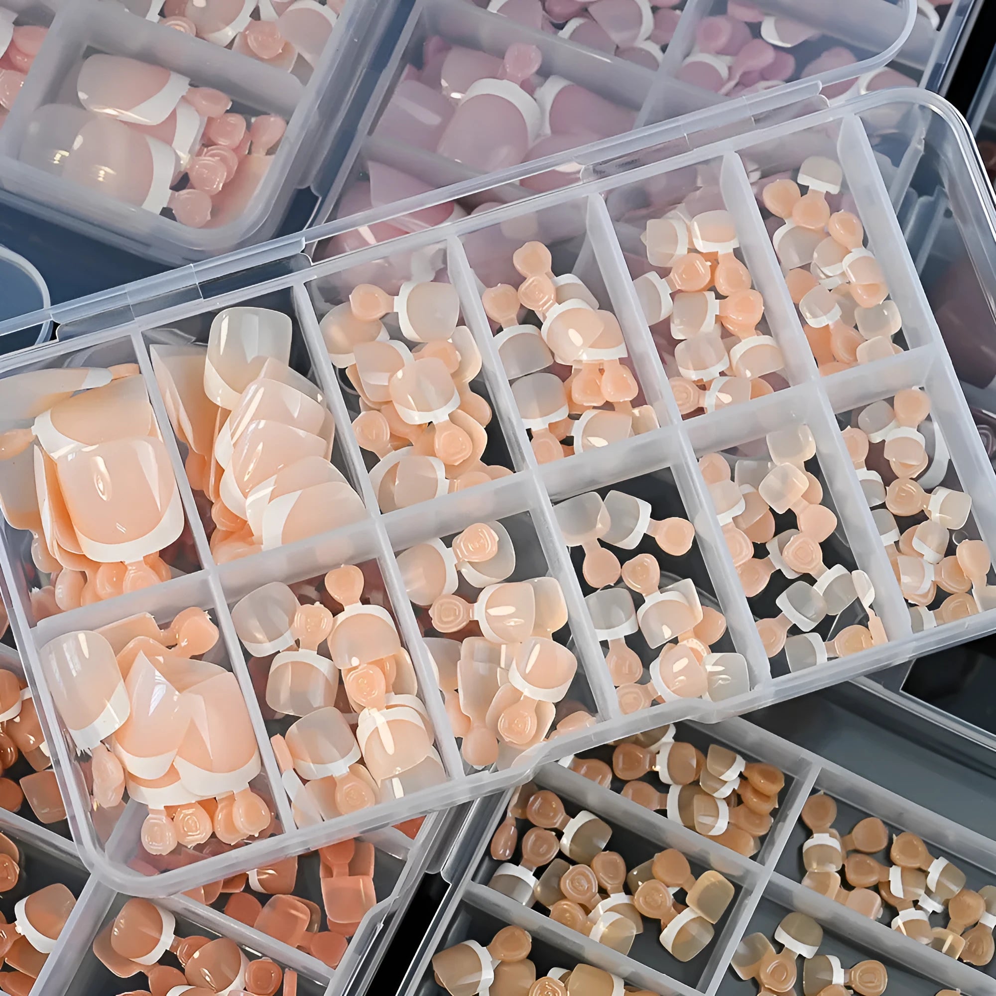 120 piece box of French white edge square toe nail capsules in nine nude colour shades