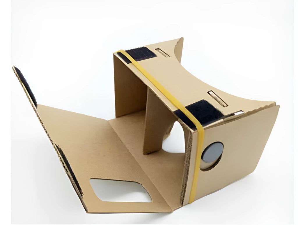 Pink and white cardboard VR glasses with rubber head strap and magnetic button for smartphones.