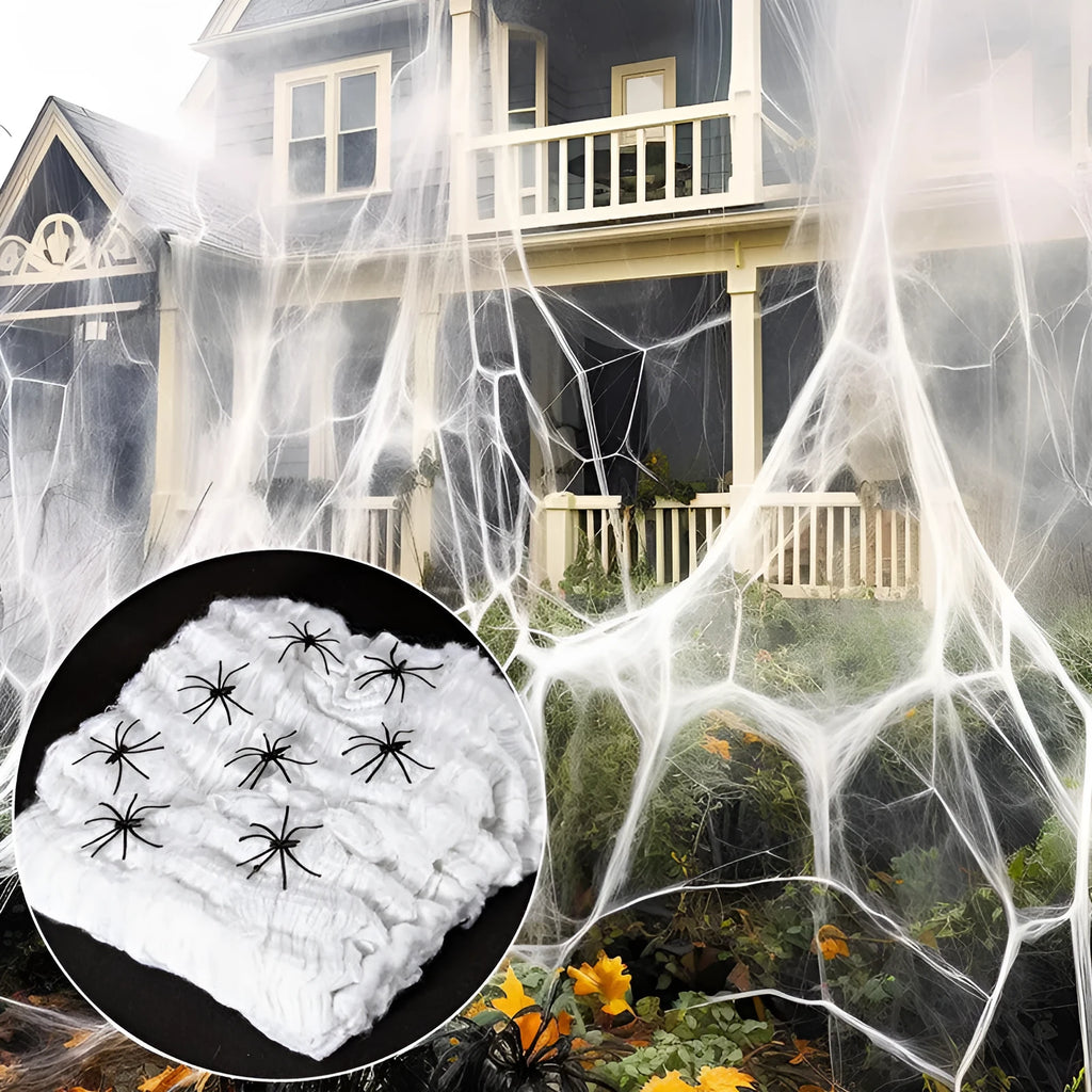 White cotton spider web Halloween decoration props draped across corner with multiple spiders