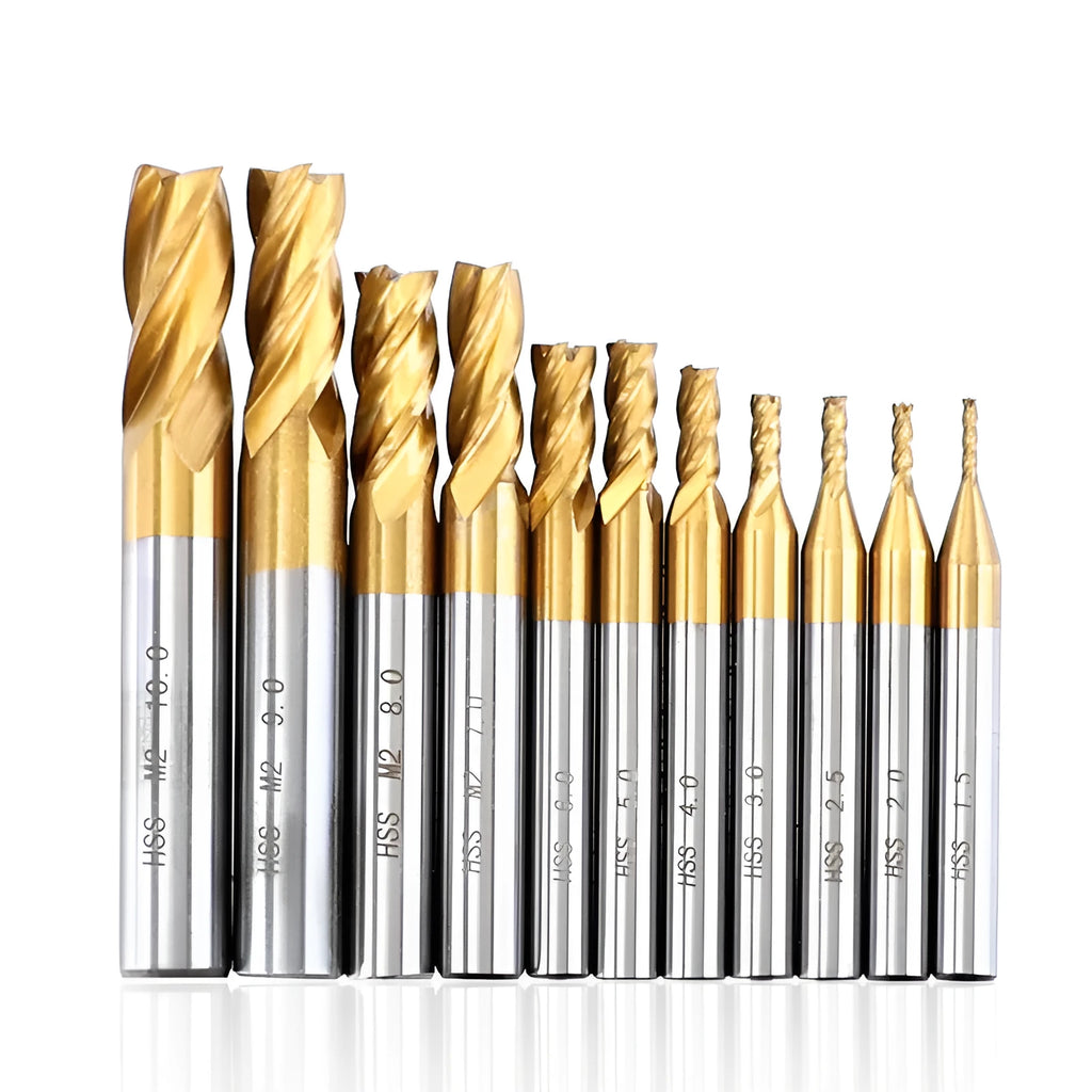 Set of 7 high speed steel 4-flute end mills with round shank on a metal workbench